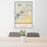 24x36 Lake Charles Louisiana Map Print Portrait Orientation in Woodblock Style Behind 2 Chairs Table and Potted Plant