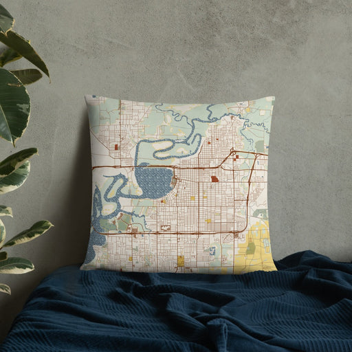 Custom Lake Charles Louisiana Map Throw Pillow in Woodblock on Bedding Against Wall