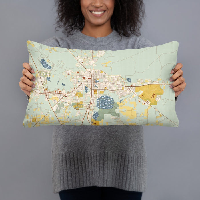 Person holding 20x12 Custom Lake City Florida Map Throw Pillow in Woodblock