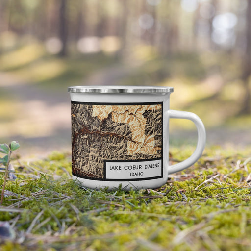 Right View Custom Lake Coeur d'Alene Idaho Map Enamel Mug in Ember on Grass With Trees in Background