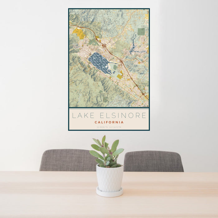 24x36 Lake Elsinore California Map Print Portrait Orientation in Woodblock Style Behind 2 Chairs Table and Potted Plant