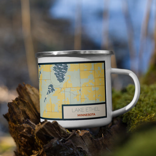 Right View Custom Lake Ethel Minnesota Map Enamel Mug in Woodblock on Grass With Trees in Background