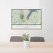 24x36 Lake George New York Map Print Lanscape Orientation in Woodblock Style Behind 2 Chairs Table and Potted Plant