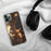 Custom Lake George New York Map Phone Case in Ember on Table with Black Headphones