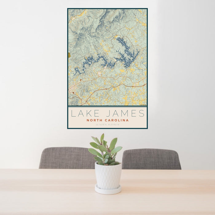 24x36 Lake James North Carolina Map Print Portrait Orientation in Woodblock Style Behind 2 Chairs Table and Potted Plant