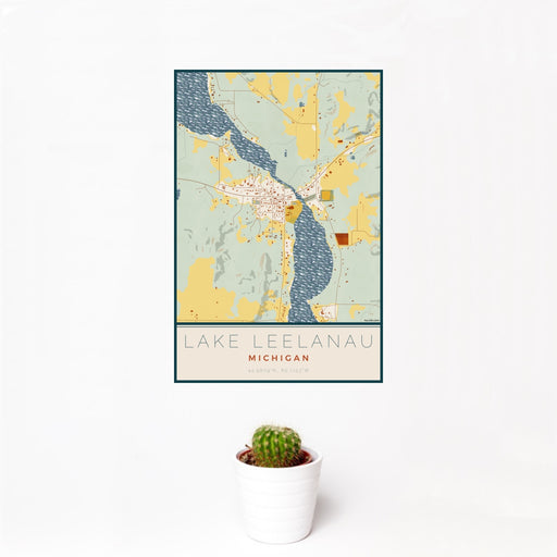 12x18 Lake Leelanau Michigan Map Print Portrait Orientation in Woodblock Style With Small Cactus Plant in White Planter