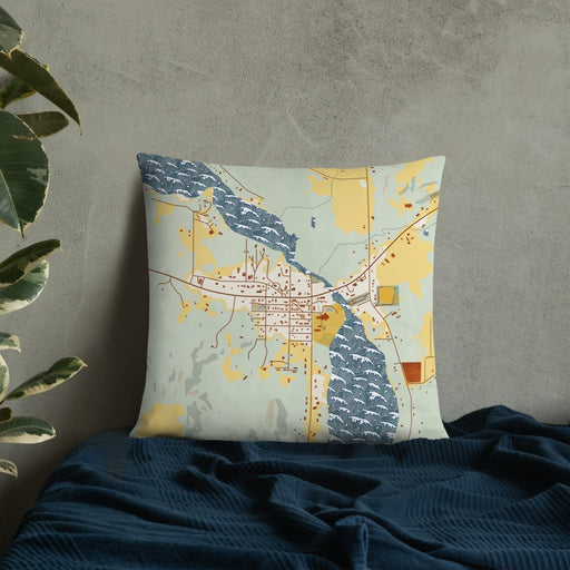 Custom Lake Leelanau Michigan Map Throw Pillow in Woodblock on Bedding Against Wall