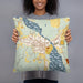 Person holding 18x18 Custom Lake Leelanau Michigan Map Throw Pillow in Woodblock