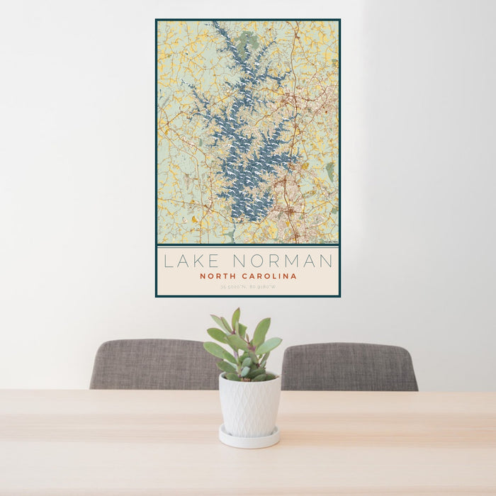 24x36 Lake Norman North Carolina Map Print Portrait Orientation in Woodblock Style Behind 2 Chairs Table and Potted Plant