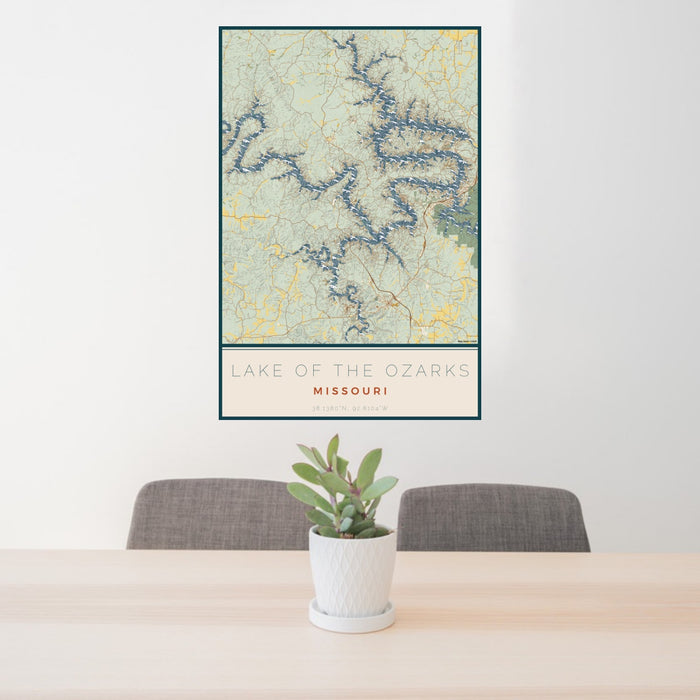 24x36 Lake of the Ozarks Missouri Map Print Portrait Orientation in Woodblock Style Behind 2 Chairs Table and Potted Plant