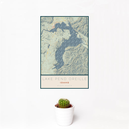 12x18 Lake Pend Oreille Idaho Map Print Portrait Orientation in Woodblock Style With Small Cactus Plant in White Planter