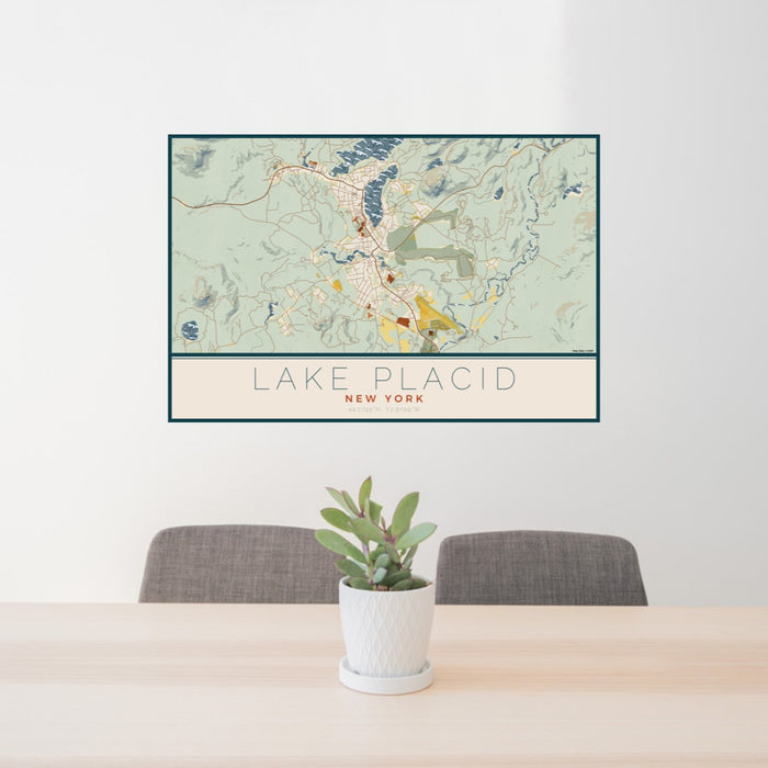 24x36 Lake Placid New York Map Print Lanscape Orientation in Woodblock Style Behind 2 Chairs Table and Potted Plant