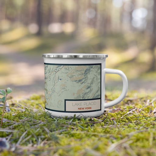 Right View Custom Lake Placid New York Map Enamel Mug in Woodblock on Grass With Trees in Background