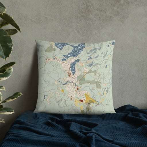 Custom Lake Placid New York Map Throw Pillow in Woodblock on Bedding Against Wall
