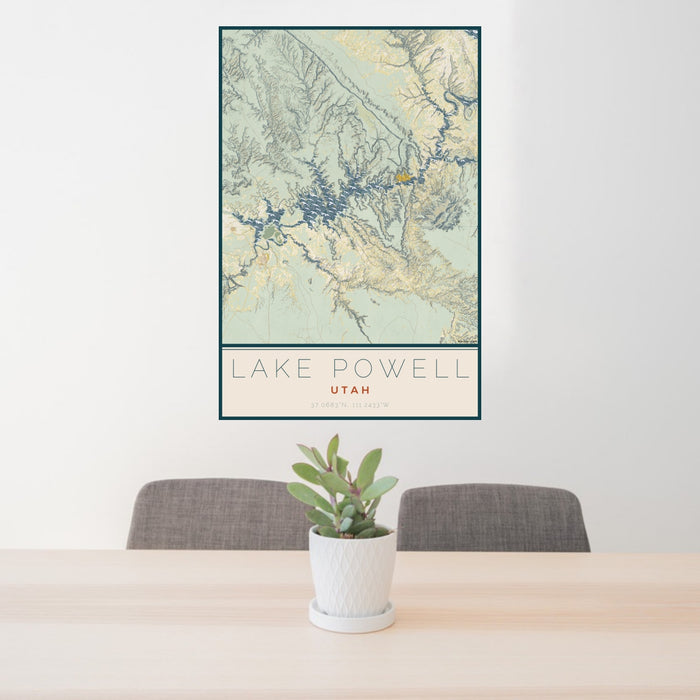 24x36 Lake Powell Utah Map Print Portrait Orientation in Woodblock Style Behind 2 Chairs Table and Potted Plant