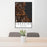 24x36 Lakeside Montana Map Print Portrait Orientation in Ember Style Behind 2 Chairs Table and Potted Plant