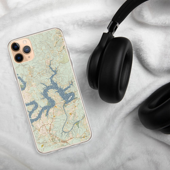 Custom Lake Travis Texas Map Phone Case in Woodblock on Table with Black Headphones