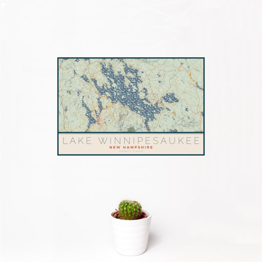12x18 Lake Winnipesaukee New Hampshire Map Print Landscape Orientation in Woodblock Style With Small Cactus Plant in White Planter