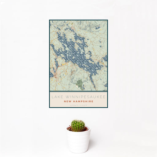 12x18 Lake Winnipesaukee New Hampshire Map Print Portrait Orientation in Woodblock Style With Small Cactus Plant in White Planter