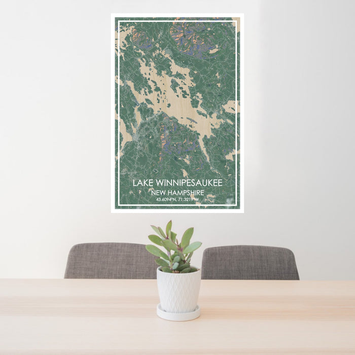 24x36 Lake Winnipesaukee New Hampshire Map Print Portrait Orientation in Afternoon Style Behind 2 Chairs Table and Potted Plant