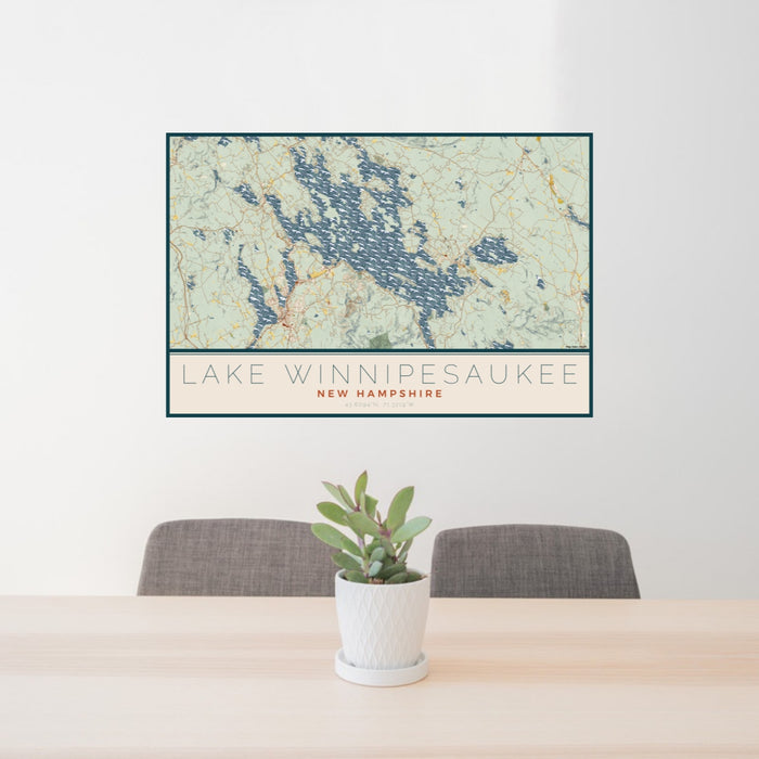 24x36 Lake Winnipesaukee New Hampshire Map Print Lanscape Orientation in Woodblock Style Behind 2 Chairs Table and Potted Plant