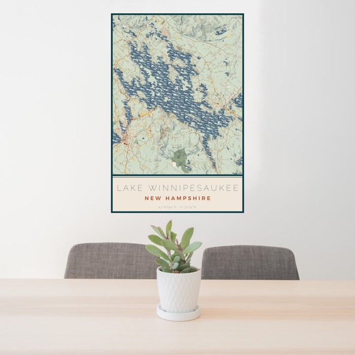 24x36 Lake Winnipesaukee New Hampshire Map Print Portrait Orientation in Woodblock Style Behind 2 Chairs Table and Potted Plant