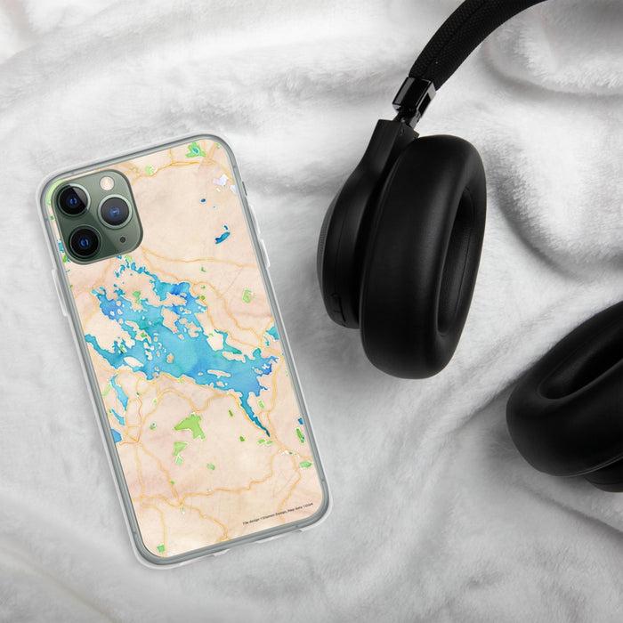 Custom Lake Winnipesaukee New Hampshire Map Phone Case in Watercolor on Table with Black Headphones