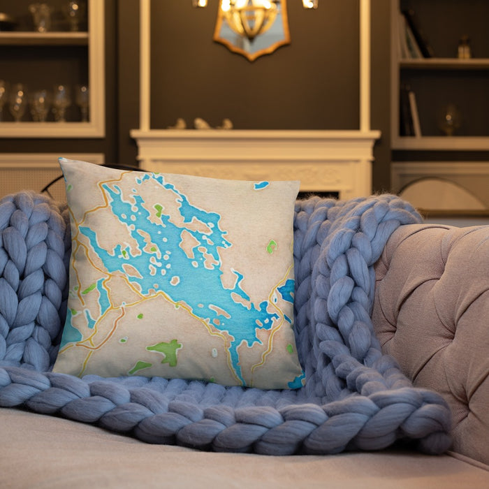 Custom Lake Winnipesaukee New Hampshire Map Throw Pillow in Watercolor on Cream Colored Couch