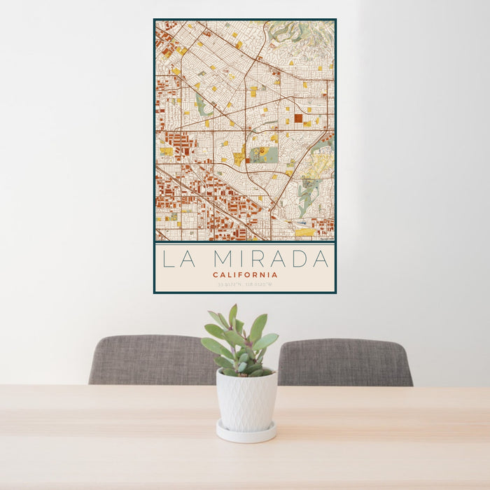 24x36 La Mirada California Map Print Portrait Orientation in Woodblock Style Behind 2 Chairs Table and Potted Plant