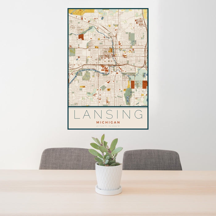 24x36 Lansing Michigan Map Print Portrait Orientation in Woodblock Style Behind 2 Chairs Table and Potted Plant