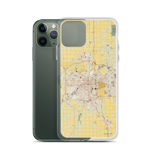 Custom Lansing Michigan Map Phone Case in Woodblock on Table with Laptop and Plant