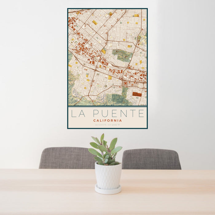24x36 La Puente California Map Print Portrait Orientation in Woodblock Style Behind 2 Chairs Table and Potted Plant