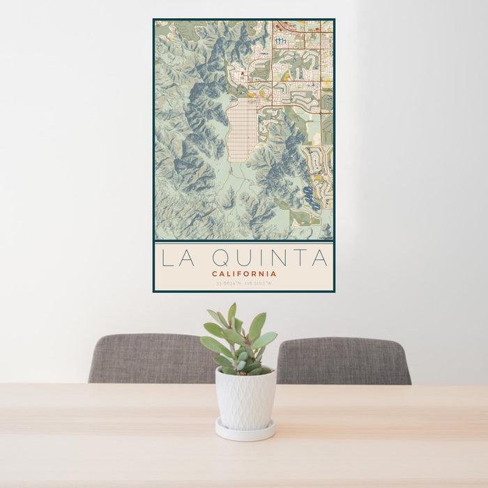 24x36 La Quinta California Map Print Portrait Orientation in Woodblock Style Behind 2 Chairs Table and Potted Plant