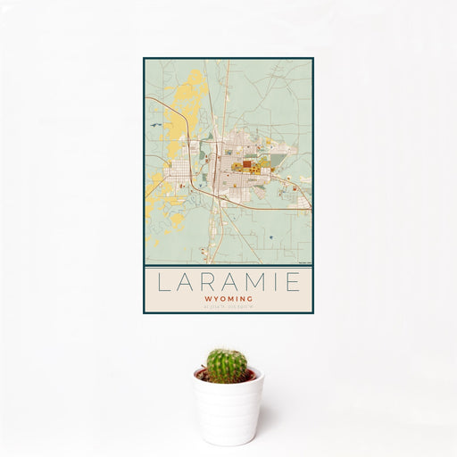 12x18 Laramie Wyoming Map Print Portrait Orientation in Woodblock Style With Small Cactus Plant in White Planter