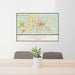 24x36 Laramie Wyoming Map Print Lanscape Orientation in Woodblock Style Behind 2 Chairs Table and Potted Plant