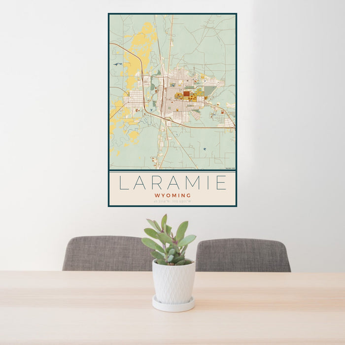 24x36 Laramie Wyoming Map Print Portrait Orientation in Woodblock Style Behind 2 Chairs Table and Potted Plant