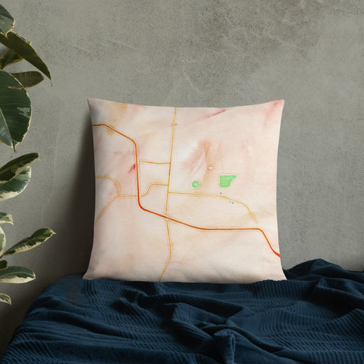 Custom Laramie Wyoming Map Throw Pillow in Watercolor on Bedding Against Wall