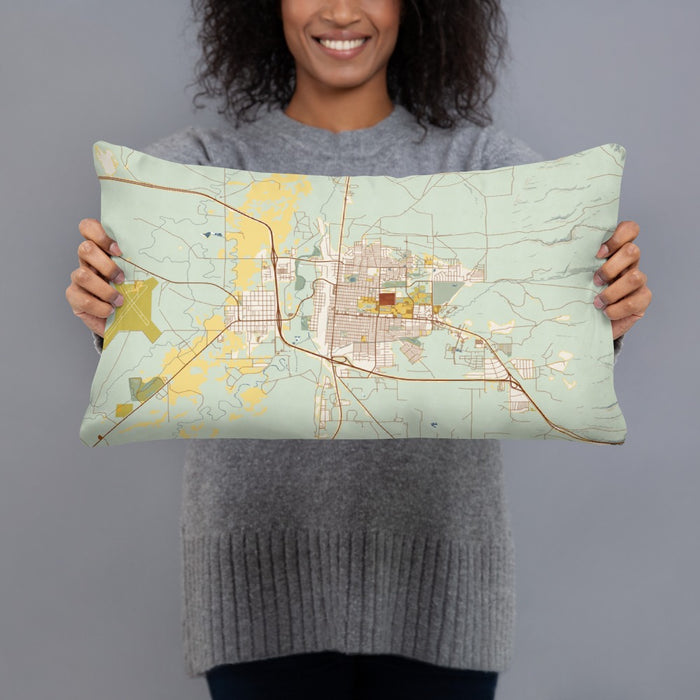Person holding 20x12 Custom Laramie Wyoming Map Throw Pillow in Woodblock