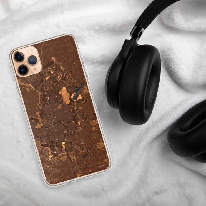Custom Laredo Texas Map Phone Case in Ember on Table with Black Headphones