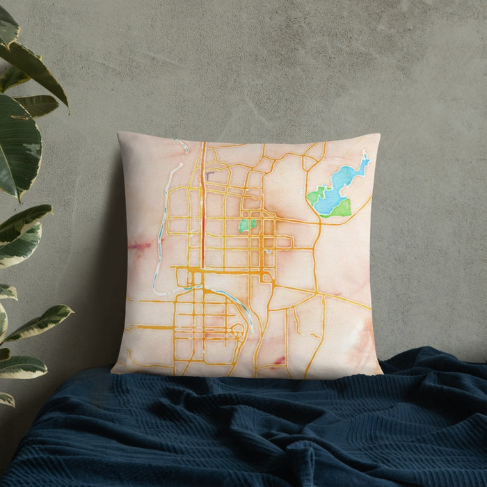 Custom Laredo Texas Map Throw Pillow in Watercolor on Bedding Against Wall