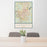 24x36 Laredo Texas Map Print Portrait Orientation in Woodblock Style Behind 2 Chairs Table and Potted Plant