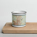 Front View Custom Laredo Texas Map Enamel Mug in Woodblock on Cutting Board