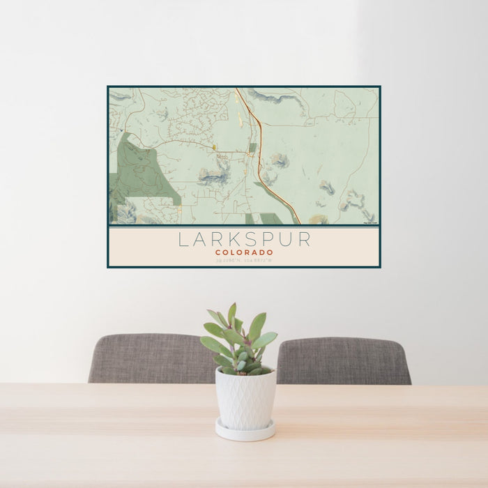 24x36 Larkspur Colorado Map Print Lanscape Orientation in Woodblock Style Behind 2 Chairs Table and Potted Plant