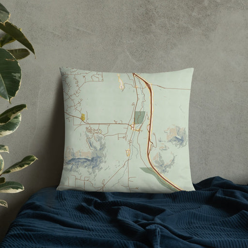 Custom Larkspur Colorado Map Throw Pillow in Woodblock on Bedding Against Wall