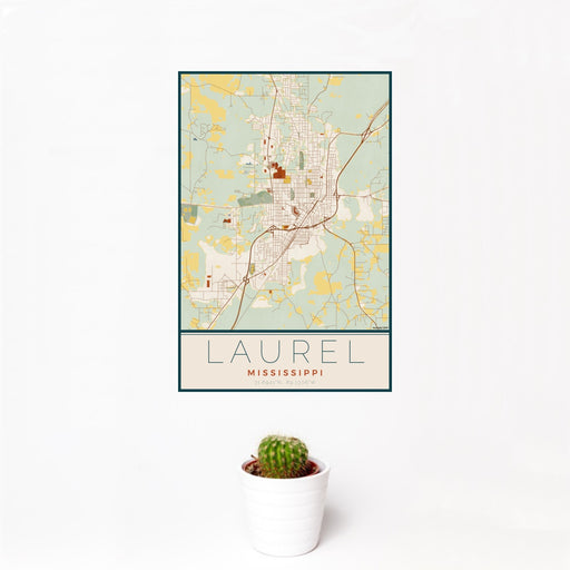 12x18 Laurel Mississippi Map Print Portrait Orientation in Woodblock Style With Small Cactus Plant in White Planter