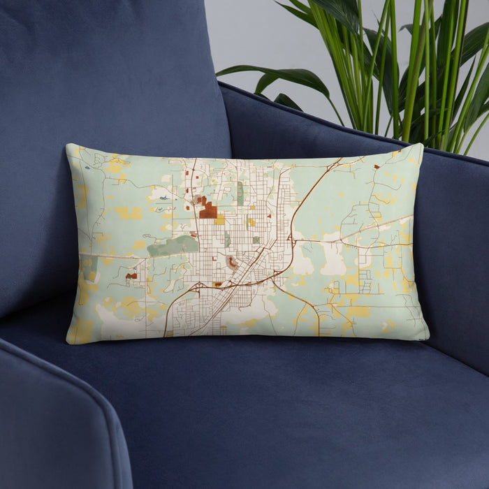 Custom Laurel Mississippi Map Throw Pillow in Woodblock on Blue Colored Chair