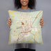 Person holding 18x18 Custom Laurel Mississippi Map Throw Pillow in Woodblock