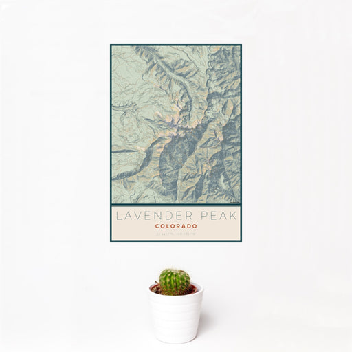 12x18 Lavender Peak Colorado Map Print Portrait Orientation in Woodblock Style With Small Cactus Plant in White Planter