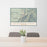 24x36 Lavender Peak Colorado Map Print Lanscape Orientation in Woodblock Style Behind 2 Chairs Table and Potted Plant