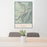 24x36 Lavender Peak Colorado Map Print Portrait Orientation in Woodblock Style Behind 2 Chairs Table and Potted Plant